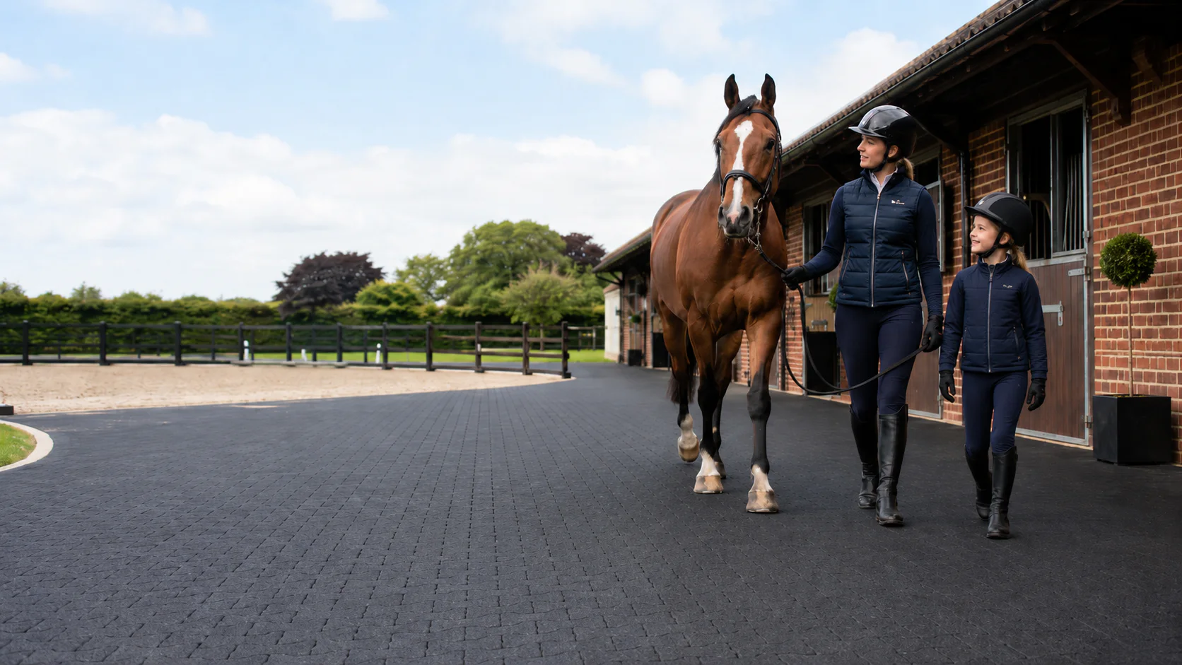 Riding school access route with rubber flooring